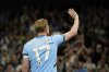Manchester City's Kevin De Bruyne waves to supporters after his final home game during the English Premier League soccer match between Manchester City and Bournemouth at the Etihad stadium in Manchester, England, Tuesday, May 20, 2025. (AP Photo/Dave Thompson)