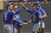From left to right, Kansas City Royals shortstop Bobby Witt, second baseman Michael Massey, first baseman Vinnie Pasquantino and catcher Freddy Fermin celebrate after their win over the Minnesota Twins in a baseball game Sunday, May 25, 2025, in Minneapolis. (AP Photo/Bruce Kluckhohn)