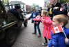 Young Dutch children wave Canadian flags as they reach out to touch the hand of a Second World War veteran as he takes part in a parade to celebrate the anniversary of the Liberation of the Netherlands in Wageningen, Netherlands on Tuesday, May 5, 2015. THE CANADIAN PRESS/Sean Kilpatrick