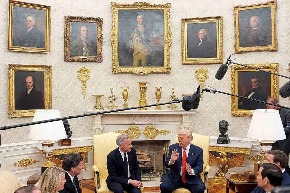 Prime Minister Mark Carney and U.S. President Donald Trump engage in a meeting at the White House in Washington, D.C., Tuesday, May 6, 2025. THE CANADIAN PRESS/Adrian Wyld
