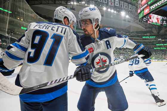 Winnipeg Jets' Cole Perfetti and Mark Scheifele talk during warmups before first Game 6. (Gareth Patterson / The Associated Press)