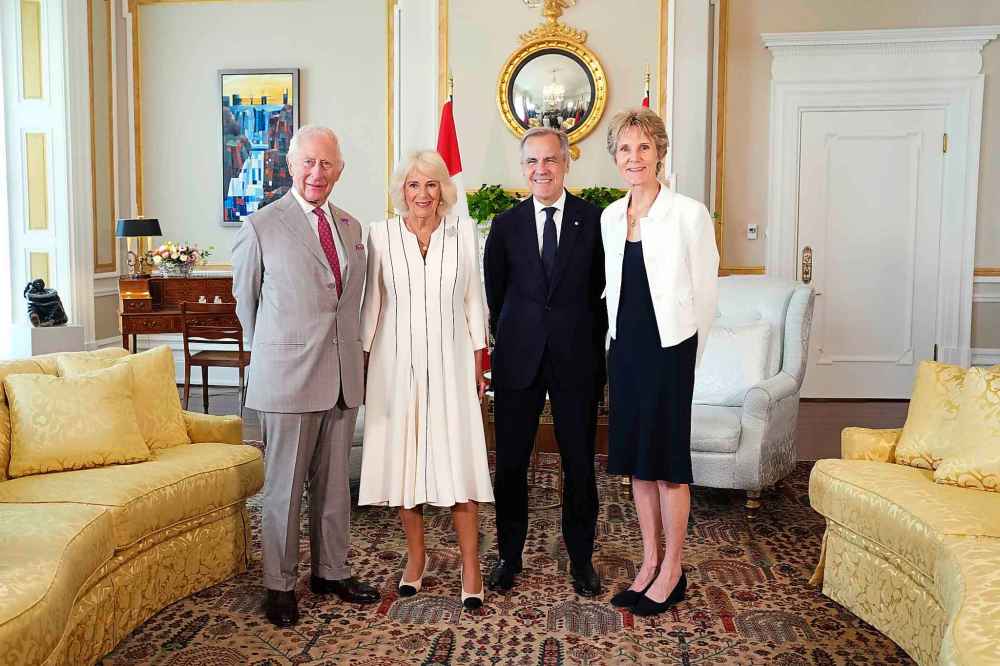 King Charles, left to right, Queen Camilla, Prime Minister Mark Carney and his wife Diana Fox Carney pose for a family portrait at Rideau Hall in Ottawa during a royal visit on Monday, May 26, 2025. THE CANADIAN PRESS/Sean Kilpatrick