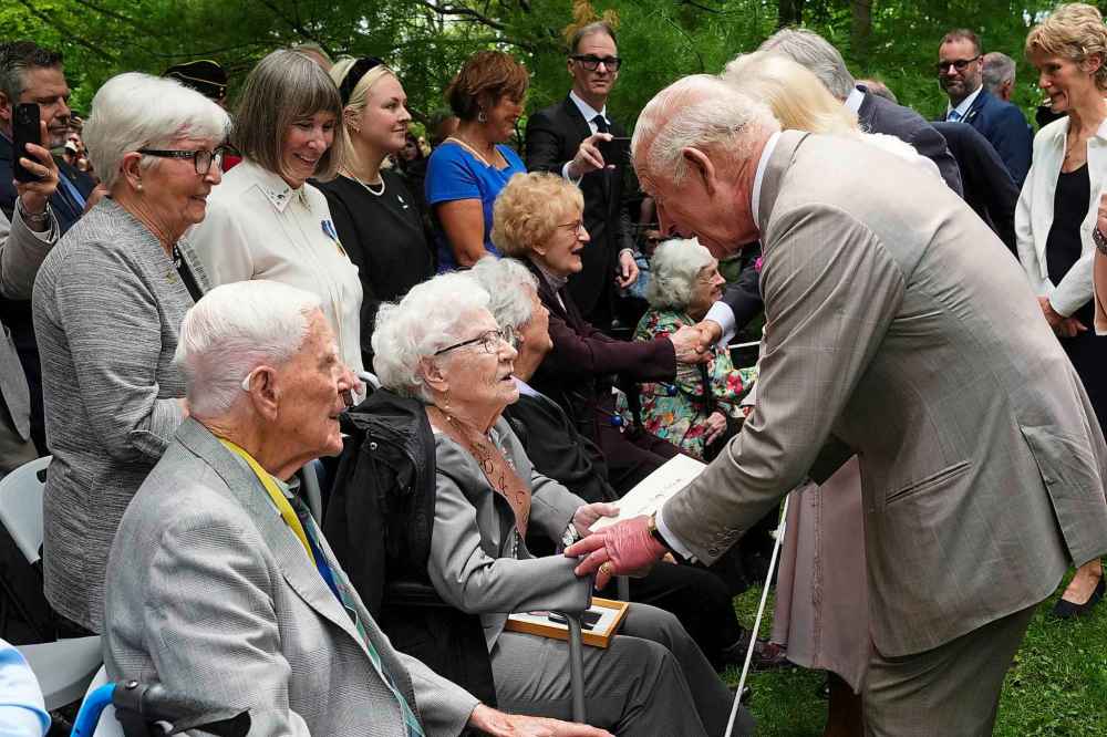 King Charles speaks with Betty Sinnett as he presents her a card for her 100th birthday in Ottawa during a royal visit on Monday, May 26, 2025. THE CANADIAN PRESS/Sean Kilpatrick