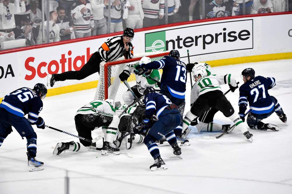 Fred Greenslade / THE CANADIAN PRESS
                                Winnipeg Jets players crowd the net around Dallas Stars goaltender Jake Oettinger trying to score in the last minutes of the third period.