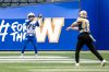 BROOK JONES/FREE PRESS
Winnipeg Blue Bombers receiver Nick Adair (No. 78) catches a pass from Bombers quarterback Chris Streveler (No. 17) during training camp at Princess Auto Stadium in Winnipeg, Man., Sunday, May 18, 2025.