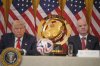 The FIFA club World Cup trophy sits between President Donald Trump and FIFA President Gianni Infantino during a FIFA task force meeting on the 2026 FIFA World Cup in the East Room of the White House, Tuesday, May 6, 2025, in Washington. (AP Photo/Mark Schiefelbein)