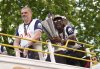 Tottenham Hotspur's Yves Bissouma and manager manager Ange Postecoglou with the trophy on the open-top team bus during the Europa League winners parade in North London, Friday, May 23, 2025. (John Walton/PA via AP)