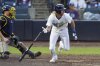Tampa Bay Rays' Travis Jankowski, right, watches his RBI single off Milwaukee Brewers pitcher Trevor Megill during the ninth inning of a baseball game Saturday, May 10, 2025, in Tampa, Fla. (AP Photo/Chris O'Meara)