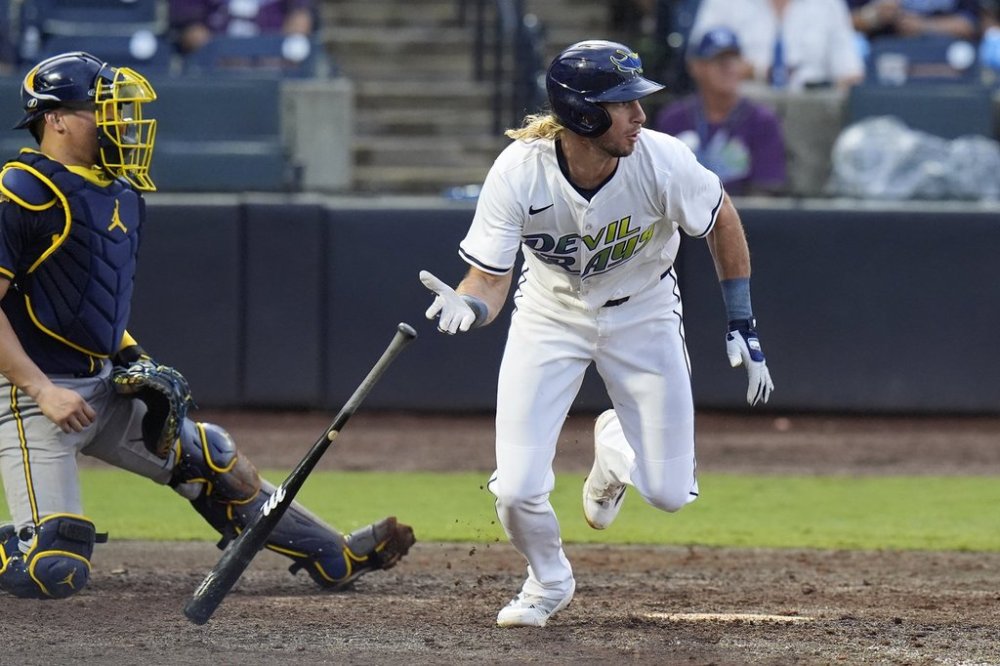 Tampa Bay Rays' Travis Jankowski, right, watches his RBI single off Milwaukee Brewers pitcher Trevor Megill during the ninth inning of a baseball game Saturday, May 10, 2025, in Tampa, Fla. (AP Photo/Chris O'Meara)