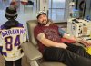 Marc Parravano's son, Christian, wears his number 84 hockey jersey to celebrate his dad's 84th blood donation in Vaughan, Ont., in this Dec. 13, 2023 handout photo. THE CANADIAN PRESS/HO, Gabriella Parravano *MANDATORY CREDIT*