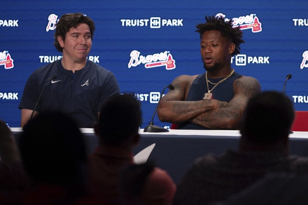 Atlanta Braves Ronald Acuña Jr. and Director of Baseball Player Relations Franco García speak with the media before a baseball game against the Washington Nationals, Wednesday, May 14, 2025 in Atlanta. (AP Photo/Kathryn Skeean)