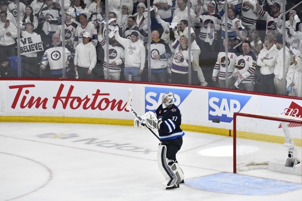Winnipeg Jets goaltender Connor Hellebuyck (37) celebrates his shutout against the Dallas Stars at the end of the third period NHL playoff hockey action in Winnipeg, Thursday, May 15, 2025. THE CANADIAN PRESS/Fred Greenslade