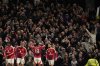 Manchester United's Casemiro celebrates with fans during the Europa League semifinal second leg soccer match between Manchester United and Athletic Bilbao in Manchester, Britain, Thursday, May 8, 2025. (AP Photo/Dave Thompson )