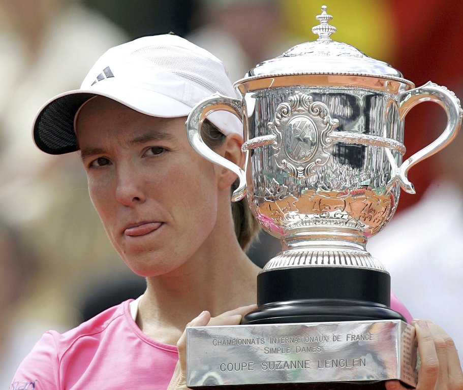 FILE - Belgium's Justine Henin poses with the trophy after beating Serbia's Ana Ivanovic in the women's final match of the French Open tennis tournament at the Roland Garros stadium in Paris, Saturday, June 9, 2007. Henin won 6-1, 6-2. (AP Photo/Lionel Cironneau, File)