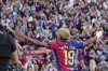 Barcelona's Lamine Yamal celebrates after scoring his side's first goal during the Spanish La Liga soccer match between Barcelona and Villarreal at Lluis Companys Olympic Stadium in Barcelona, Spain, Sunday, May 18, 2025. (AP Photo/Joan Monfort)