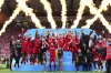 Aberdeen's team members celebrate after the Scottish Cup final soccer match between Aberdeen and Celtic at Hampden Park in Glasgow, Scotland, Saturday, May 24, 2025. (Jane Barlow/PA via AP)