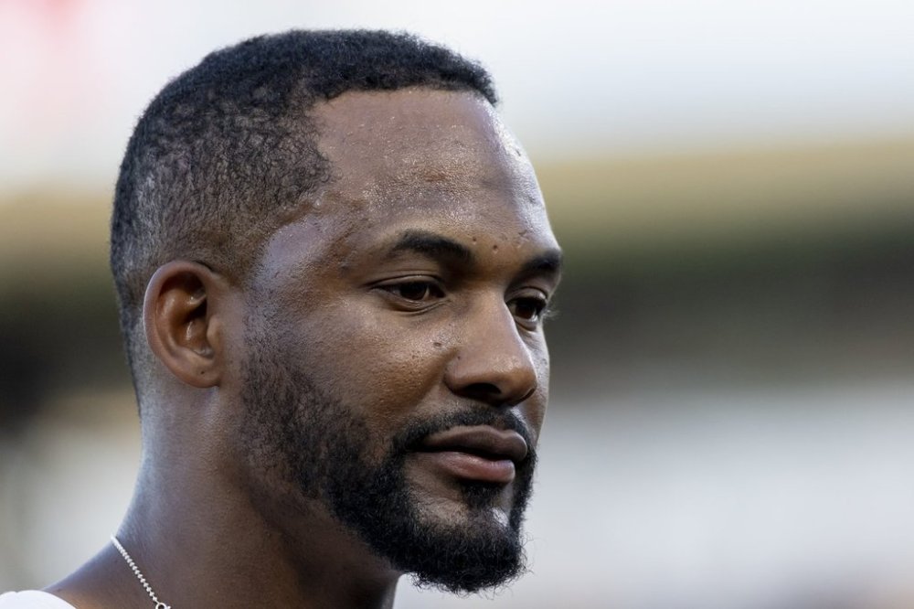 Athletics outfielder Miguel Andujar walks to the dugout during the second inning of a baseball game against the Philadelphia Phillies, Friday, May 23, 2025, in West Sacramento, Calif. (AP Photo/Sara Nevis)