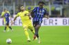 Inter Milan's Yann Bisseck fights for the ball with Lazio's Taty Castellanos during the Italian Serie A soccer match between Inter and Lazio at San Siro Stadium in Milan, North Italy, Sunday , May 18 , 2025. (Spada//LaPresse via AP)