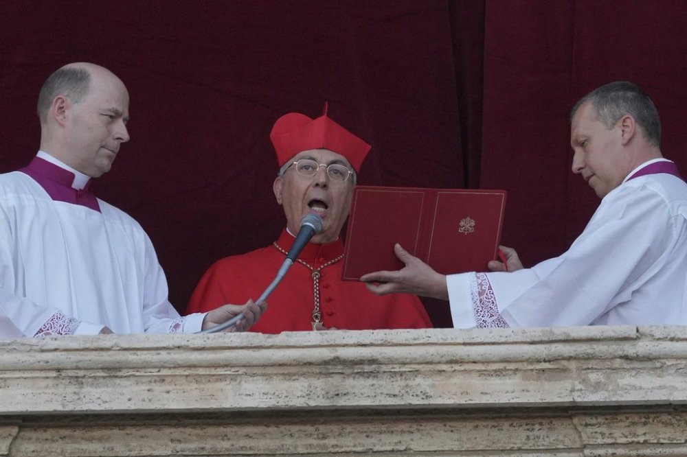 Cardinal Dominique Mamberti announces the election of the new pope, at the Vatican, Thursday, May 8, 2025. (AP Photo/Andrew Medichini)