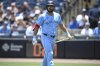 Toronto Blue Jays' Anthony Santander walks back to the dugout after striking out during the first inning of a baseball game against the Tampa Bay Rays, Sunday, May 25, 2025, in Tampa, Fla. (AP Photo/Phelan M. Ebenhack)