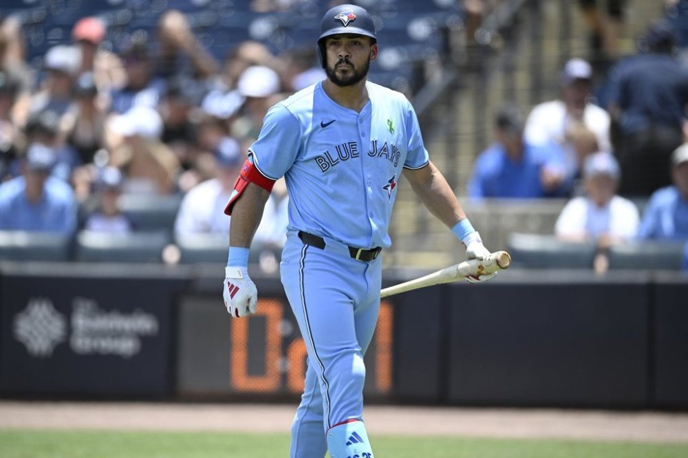 Toronto Blue Jays' Anthony Santander walks back to the dugout after striking out during the first inning of a baseball game against the Tampa Bay Rays, Sunday, May 25, 2025, in Tampa, Fla. (AP Photo/Phelan M. Ebenhack)