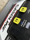 FILE - The per-gallon price is illuminated on the pump at a Costco warehouse gasoline station Tuesday, April 1, 2025, in Thornton, Colo. (AP Photo/David Zalubowski, File)