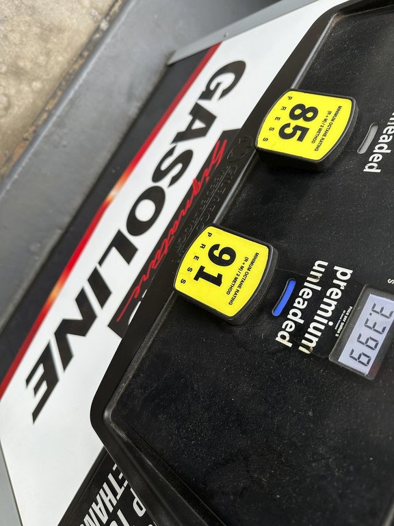 FILE - The per-gallon price is illuminated on the pump at a Costco warehouse gasoline station Tuesday, April 1, 2025, in Thornton, Colo. (AP Photo/David Zalubowski, File)
