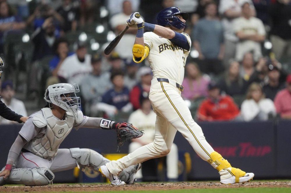 Milwaukee Brewers' Christian Yelich hits a walk off grand slam during the 10th inning of a baseball game against the Boston Red Sox, Tuesday, May 27, 2025, in Milwaukee. (AP Photo/Aaron Gash)