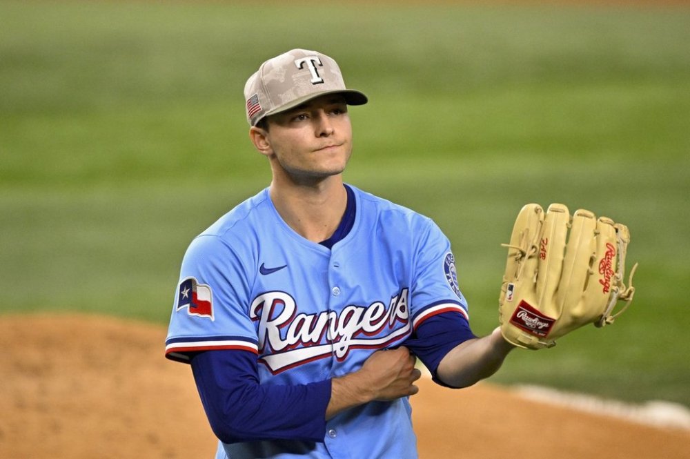 Texas Rangers starting pitcher Jack Leiter comes off the field after pitching against the Houston Astros during the fourth inning of a baseball game in Arlington, Texas, Sunday, May 18, 2025. (AP Photo/Jerome Miron)