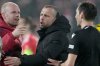 FILE - Amsterdam's head coach John Heitinga, center, after the Europa League playoff second leg soccer match between 1. FC Union Berlin and Ajax Amsterdam in Berlin, Germany, Feb. 23, 2023. (AP Photo/Michael Sohn, File)