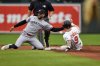 Baltimore Orioles' Tyler O'Neill (9) steals second base in front of Minnesota Twins shortstop Carlos Correa (4) to later advance to third base on a throwing error by Twins catcher Christian Vazquez during the eighth inning in the first baseball game of a doubleheader, Wednesday, May 14, 2025, in Baltimore. (AP Photo/Stephanie Scarbrough)