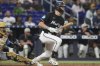 Miami Marlins' Kyle Stowers hits a single to center field during the sixth inning of a baseball game against the Tampa Bay Rays, Friday, May 16, 2025, in Miami. (AP Photo/Marta Lavandier)