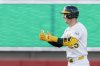 Athletics' Brent Rooker gives a thumbs up to the dugout after hitting a double during the third inning of a baseball game against the Baltimore Orioles Friday, June 6, 2025, in West Sacramento, Calif. (AP Photo/Sara Nevis)