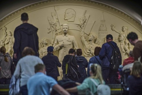 FILE - Passengers walk in front of a monument to Soviet leader Josef Stalin at the Taganskaya subway station in Moscow, Russia, on Wednesday, May 21, 2025. (AP Photo/Alexander Zemlianichenko, File)