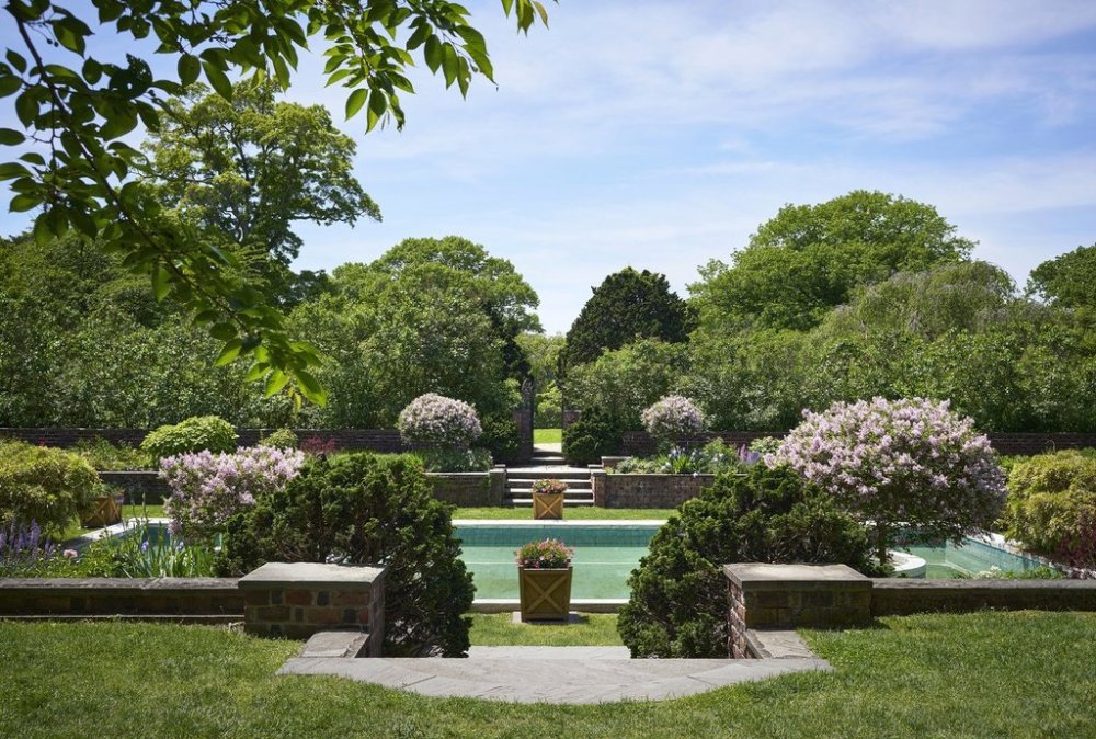 This image provided by Phaidon/Monacelli shows a springtime view of the Blue Pool Garden at Planting Fields State Historic Park in Oyster Bay, N.Y, as published in the book,