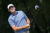 Scottie Scheffler watches a tee shot during the first round of the Charles Schwab Challenge golf tournament at Colonial Country Club in Fort Worth, Texas, Thursday, May 22, 2025. (AP Photo/LM Otero)