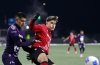 Cavalry FC's Tobias Warschewski holds off Pumas UNAM's Ricardo Galindo during second half soccer action in round one of the 2025 CONCACAF Champions Cup in Langford, B.C., on Thursday, February 6, 2025. THE CANADIAN PRESS/Chad Hipolito