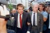 FILE - Former Cincinnati Reds manager Pete Rose is escorted by a Federal Marshal, right, as he arrives at federal court in Cincinnati, Ohio on July 19, 1990. (AP Photo/Mark Lyons, File)