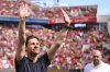 Leverkusen's head coach Xabi Alonso waves to the fans before the German Bundesliga soccer match between Bayer 04 Leverkusen and Borussia Dortmund in Leverkusen, Germany, Sunday, May 11, 2025. (Marius Becker/dpa via AP)