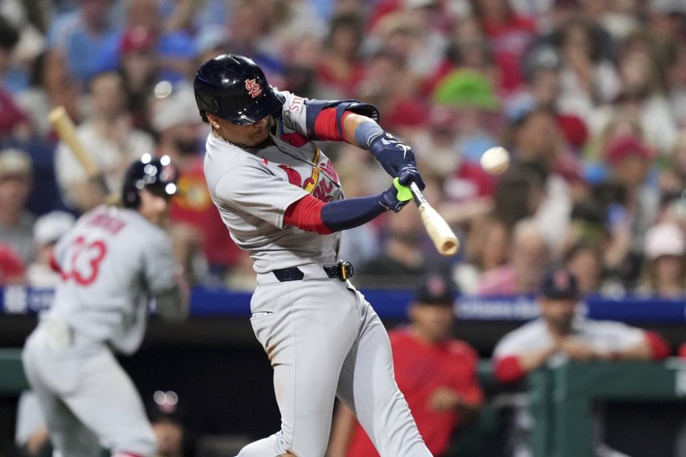 St. Louis Cardinals' Masyn Winn hits a home run against Philadelphia Phillies pitcher Matt Strahm during the seventh inning of a baseball game Monday, May 12, 2025, in Philadelphia. (AP Photo/Matt Slocum)