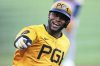 Pittsburgh Pirates' Alexander Canario celebrates as he rounds third after hitting a solo home run off Atlanta Braves pitcher Bryce Elder during the third inning of a baseball game in Pittsburgh, Friday, May 9, 2025. (AP Photo/Gene J. Puskar)