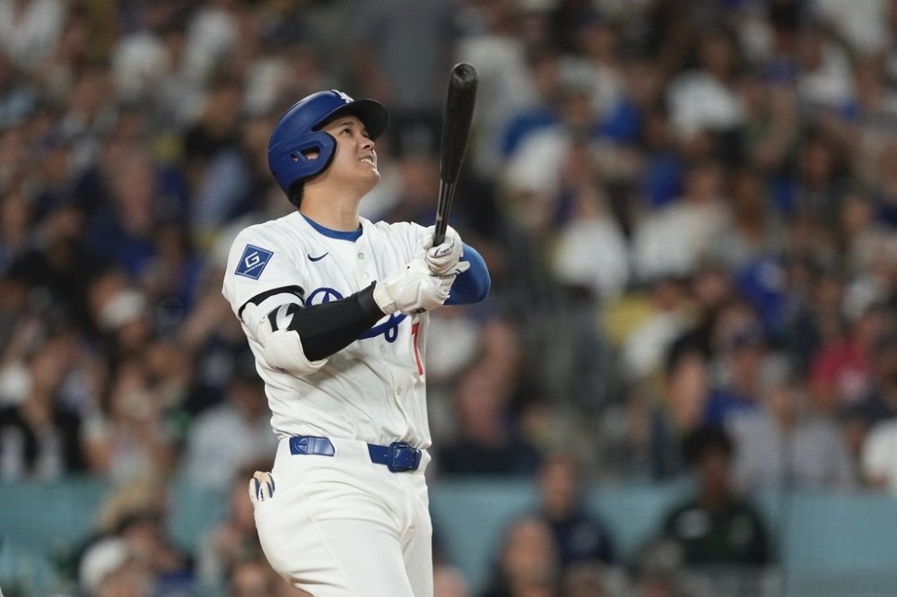 Los Angeles Dodgers' Shohei Ohtani hits a solo home run during the sixth inning of a baseball game against the New York Yankees, Friday, May 30, 2025, in Los Angeles. (AP Photo/Mark J. Terrill)