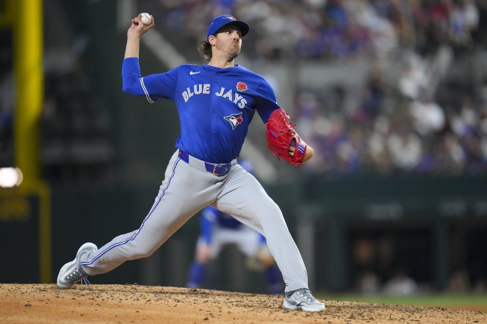 Toronto Blue Jays starting pitcher Kevin Gausman throws a pitch to the Texas Rangers during the eighth inning of a baseball game, Monday, May 26, 2025, in Arlington, Texas. (AP Photo/Julio Cortez)