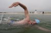 Endurance swimmer Louis Pugh swims near the Edgartown Harbor Light, Thursday, May 15, 2025, in Edgartown, Mass. (AP Photo/Robert F. Bukaty)