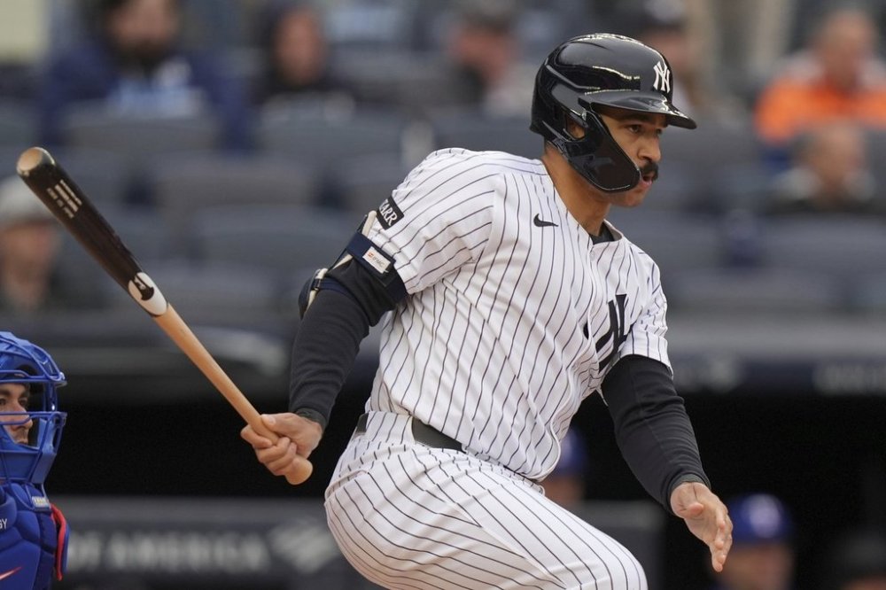 New York Yankees' Trent Grisham hits a single during the fifth inning of a baseball game against the Texas Rangers, Thursday, May 22, 2025, in New York. (AP Photo/Frank Franklin II)