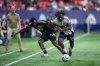 Minnesota United's Bongokuhle Hlongwane, left, and Vancouver Whitecaps' J.C. Ngando vie for the ball during the first half of an MLS game in Vancouver on Wednesday, May 28, 2025. THE CANADIAN PRESS/Darryl Dyck