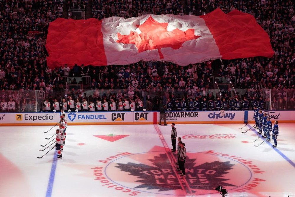 Fans hold the Canadian flag is shown during the national anthems ahead of Game 1 between the Toronto Maple Leafs and the Florida Panthers on Monday, May 5, 2025. THE CANADIAN PRESS/Frank Gunn