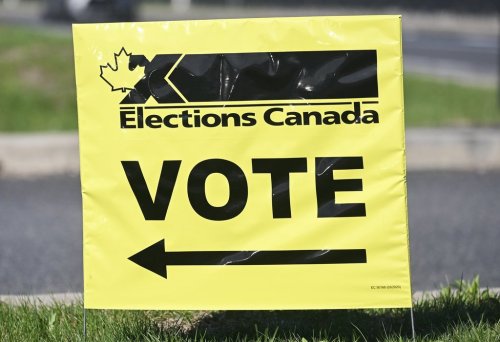 An Elections Canada sign points the way to a polling station on federal election day in Chambly, Que., Monday, April 28, 2025. THE CANADIAN PRESS/Graham Hughes