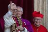 Newly elected Pope Leo XIV, left, formerly Cardinal Robert Francis Prevost, appears with, from left, Master of Ceremonies Archbishop Diego Giovanni Ravelli, and former Vatican Secretary of State Cardinal Pietro Parolin on the central loggia of St. Peter's Basilica at the Vatican shortly after his election as the 267th pontiff of the Roman Catholic Church, Thursday, May 8, 2025. (AP Photo/Domenico Stinellis)