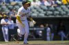 Athletics' Gio Urshela (13) watches his hit during the third inning of a baseball game against the Los Angeles Angels in West Sacramento, Calif., Thursday, May 22, 2025. (AP Photo/Nic Coury)